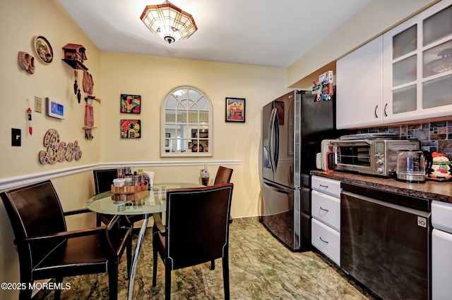 kitchen with white cabinets and black appliances