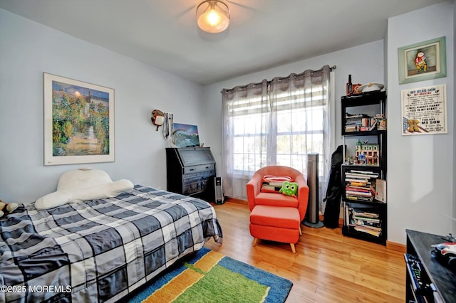 bedroom featuring wood-type flooring