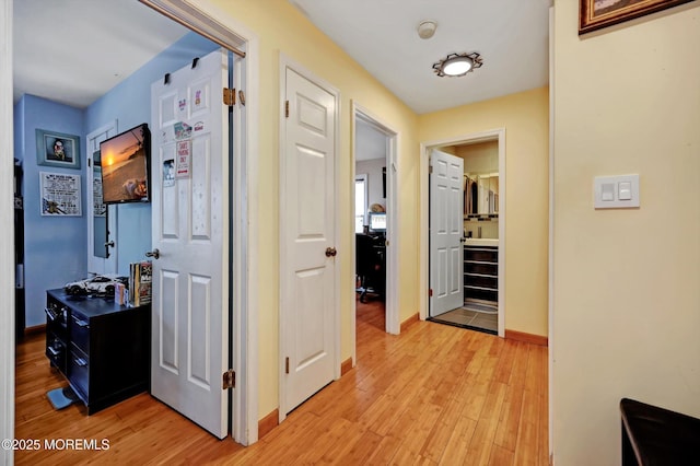 corridor featuring light hardwood / wood-style flooring