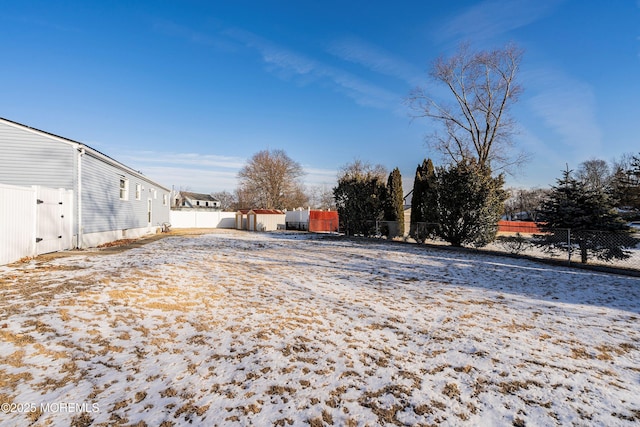 view of yard covered in snow