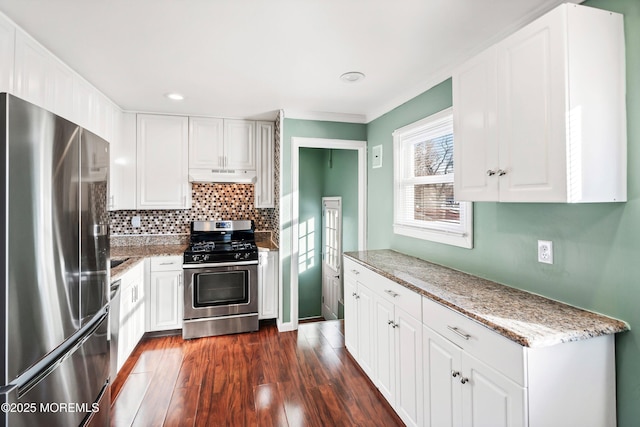 kitchen featuring white cabinetry, backsplash, dark hardwood / wood-style flooring, and stainless steel appliances