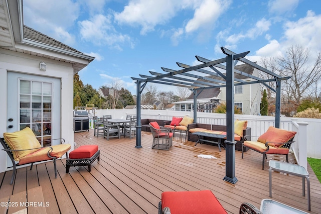 wooden terrace featuring outdoor lounge area and a pergola