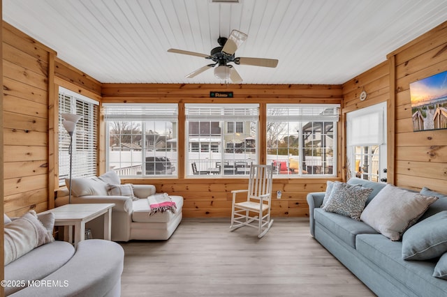 sunroom featuring ceiling fan