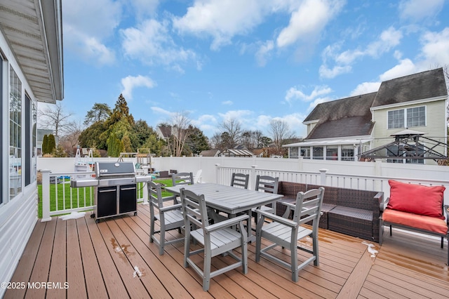 wooden terrace featuring outdoor lounge area