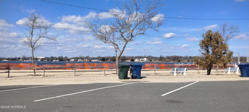 uncovered parking lot with fence