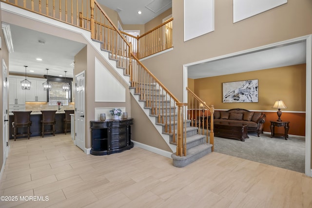 stairs featuring a high ceiling