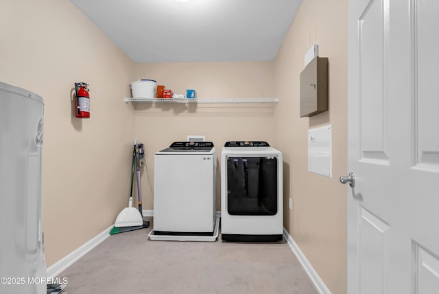 laundry area with electric panel and independent washer and dryer