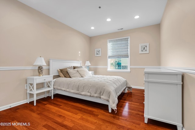 bedroom with hardwood / wood-style floors