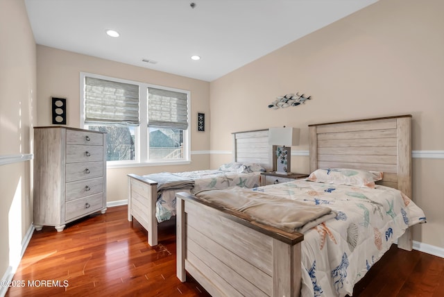 bedroom featuring dark hardwood / wood-style flooring