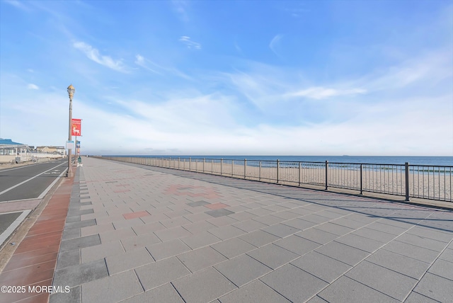 view of patio with a water view