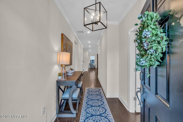 entrance foyer featuring crown molding and dark hardwood / wood-style floors