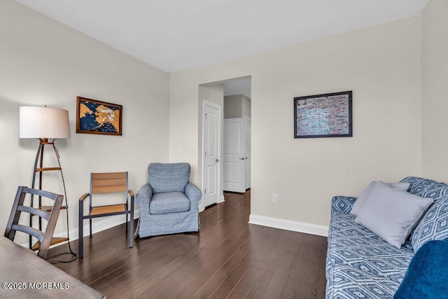 sitting room with dark hardwood / wood-style flooring