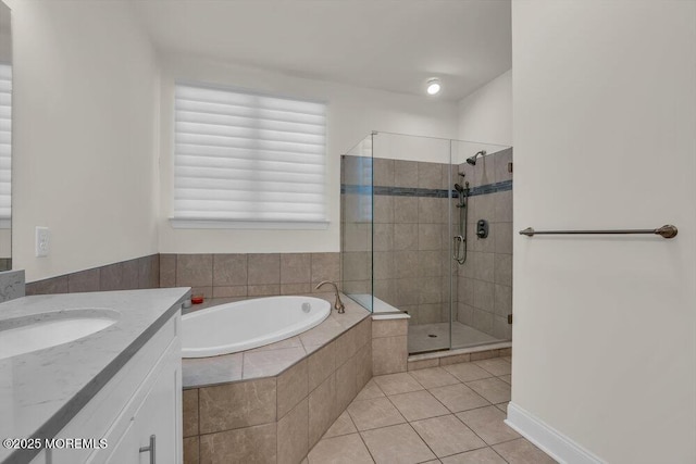 bathroom with vanity, separate shower and tub, and tile patterned floors