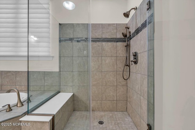 bathroom with separate shower and tub