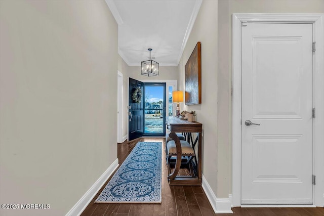 interior space with crown molding and an inviting chandelier