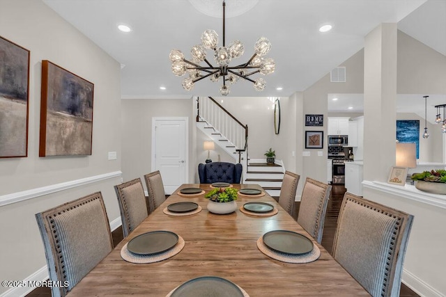 dining area featuring a chandelier and vaulted ceiling