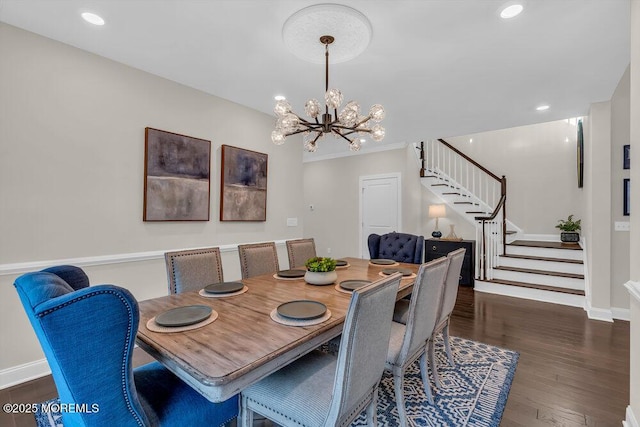 dining area featuring dark wood-type flooring and a notable chandelier