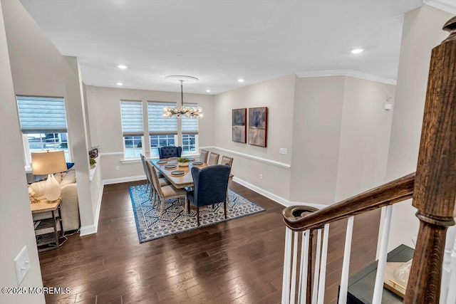 dining space featuring crown molding, dark hardwood / wood-style floors, and a chandelier