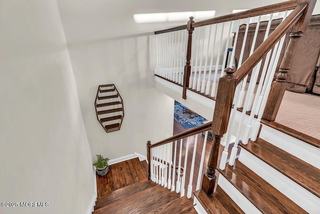 stairs with hardwood / wood-style flooring