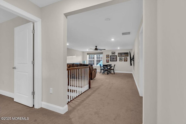 hallway with carpet floors