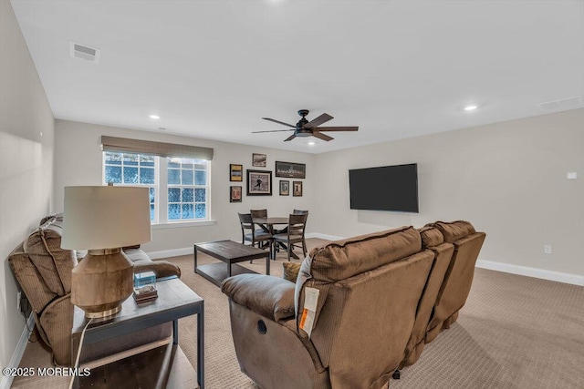 carpeted living room featuring ceiling fan