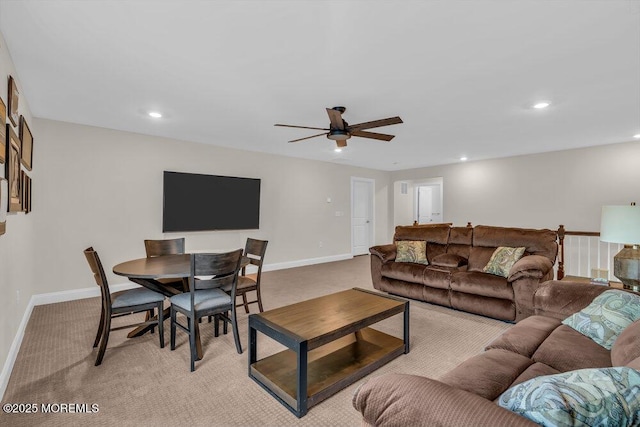 living room with light colored carpet and ceiling fan