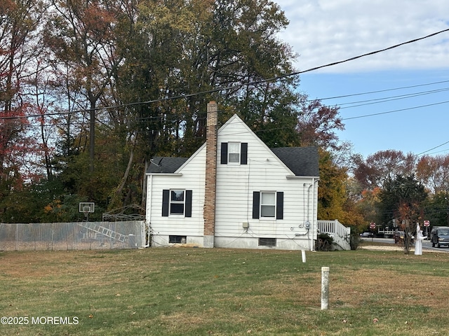 view of home's exterior with a lawn