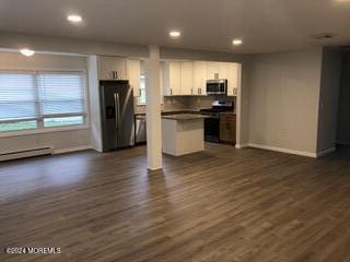 kitchen featuring baseboard heating, stainless steel appliances, a center island, dark hardwood / wood-style floors, and white cabinets