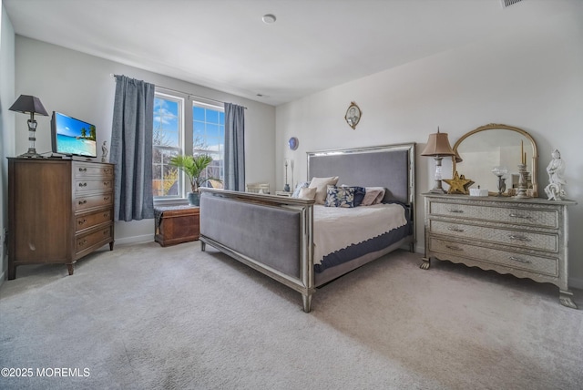 bedroom with light colored carpet