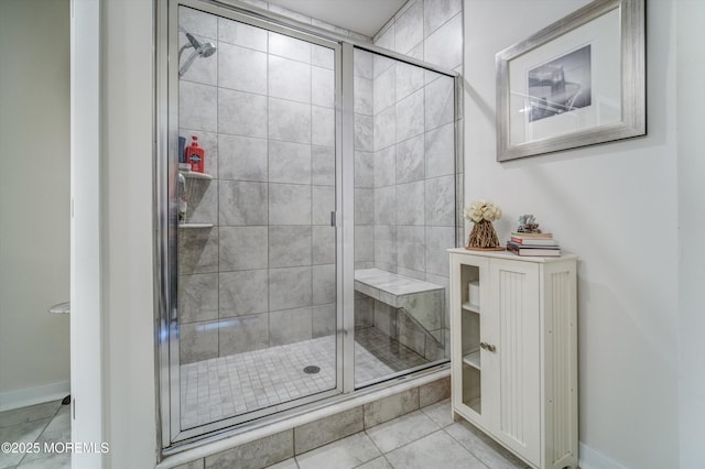 bathroom featuring tile patterned flooring and walk in shower