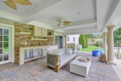 view of patio / terrace with an outdoor kitchen and ceiling fan