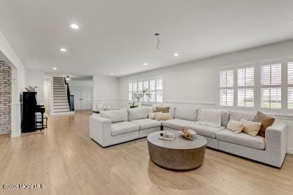 living room with light hardwood / wood-style flooring