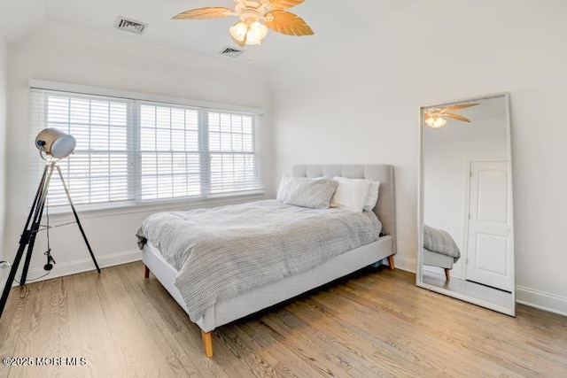 bedroom with hardwood / wood-style flooring and ceiling fan