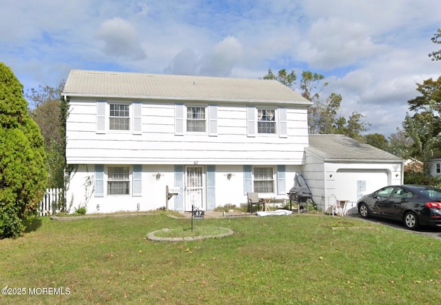 view of front of home with a garage and a front lawn