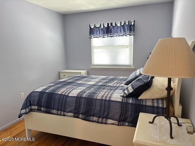 bedroom featuring wood-type flooring