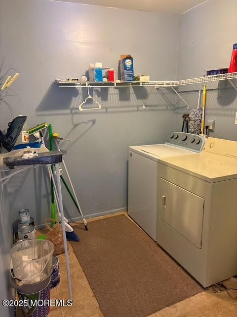 laundry area with washing machine and dryer