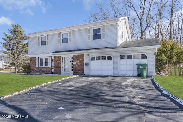 front of property featuring a garage and a front yard