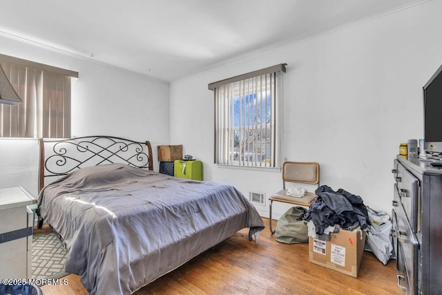 bedroom with light hardwood / wood-style floors