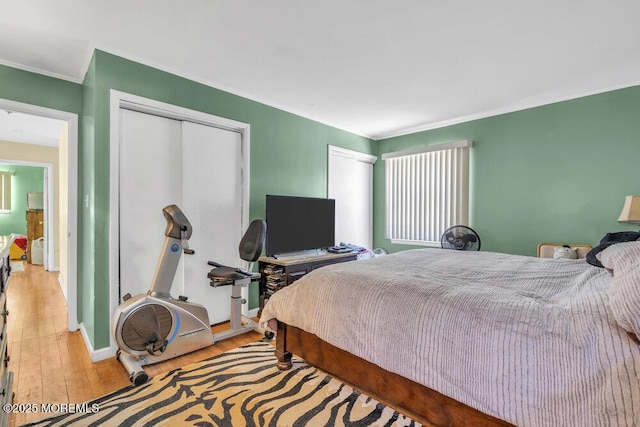 bedroom featuring light hardwood / wood-style floors and a closet