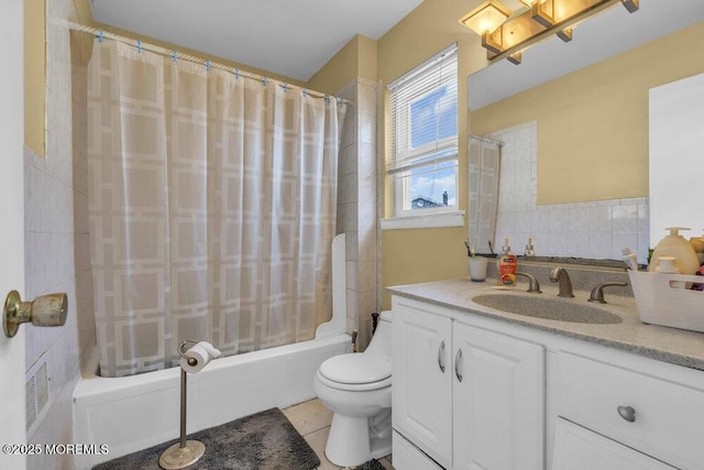 full bathroom with tile patterned flooring, backsplash, vanity, shower / bath combination with curtain, and toilet