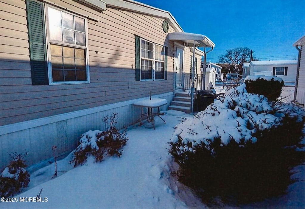 view of snow covered property