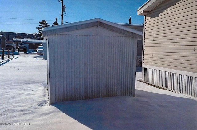 view of side of property with a storage shed