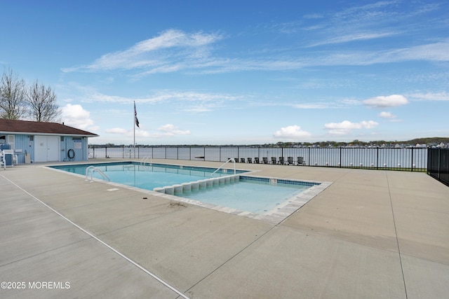 view of pool featuring a water view