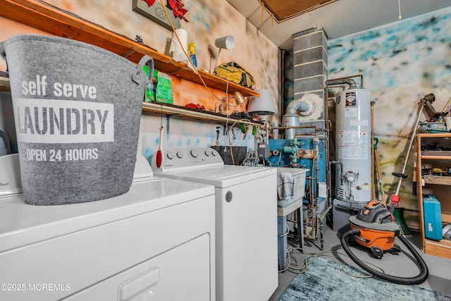 clothes washing area featuring washer and dryer and gas water heater