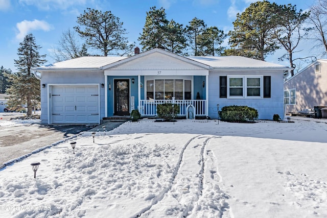 single story home with a garage and covered porch