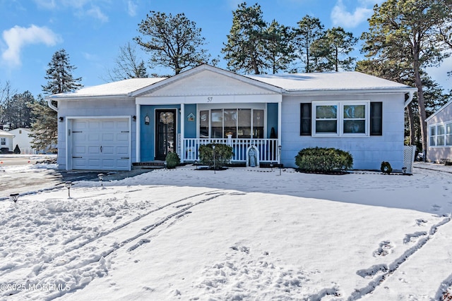 single story home with a garage and covered porch