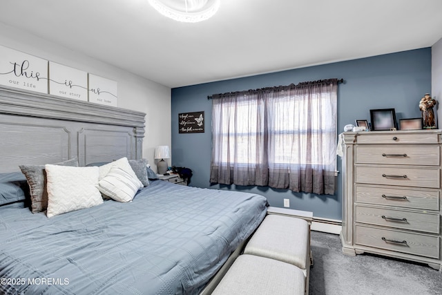 carpeted bedroom featuring baseboard heating