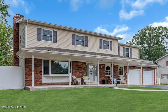 view of front facade with a porch, a garage, and a front yard