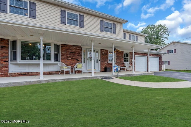 view of front of home featuring covered porch and a front lawn