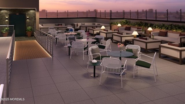 view of patio terrace at dusk